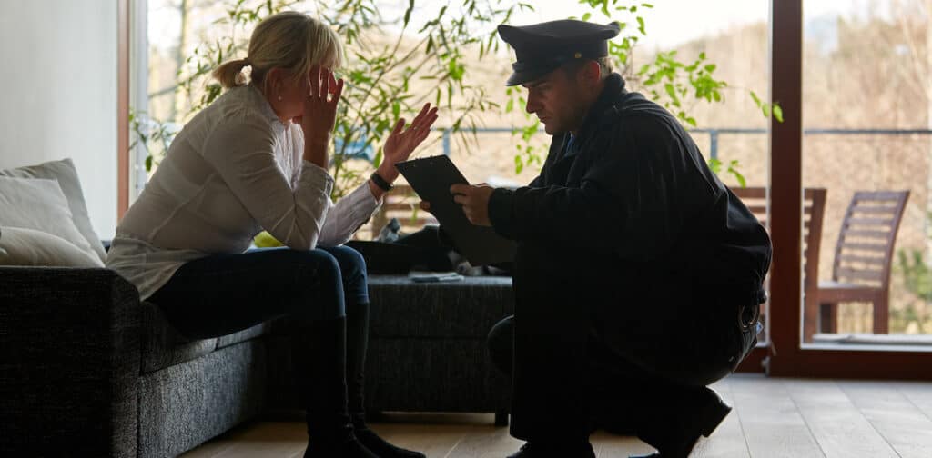 Police talking to and calming down a victim