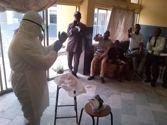 The Clade X exercise revealed a "Wicked Problem" and the real value of a great tabletop exercise 2 A CDC instructor wearing full personal protective equipment demonstrates Ebola infection control procedures to a seated group during a training session in Lagos, Nigeria